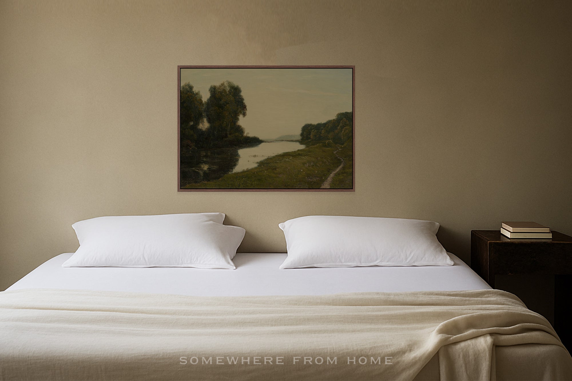 Bedroom with a bed, nightstand, and wall art of a landscape painting with river and trees with muted green