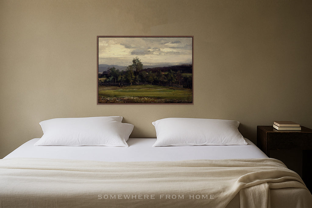 Vintage green landscape painting of a golf course fairway in a Bedroom with a bed, nightstand, and painting on the wall.