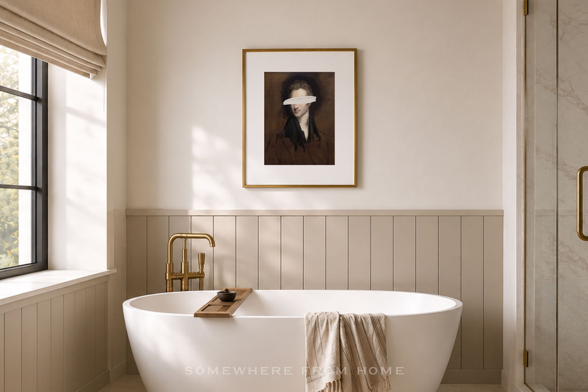 A framed art print depicting a blindfolded woman hangs on a beige wall above a white freestanding bathtub in a softly lit bathroom with wood paneling and a gold faucet.
