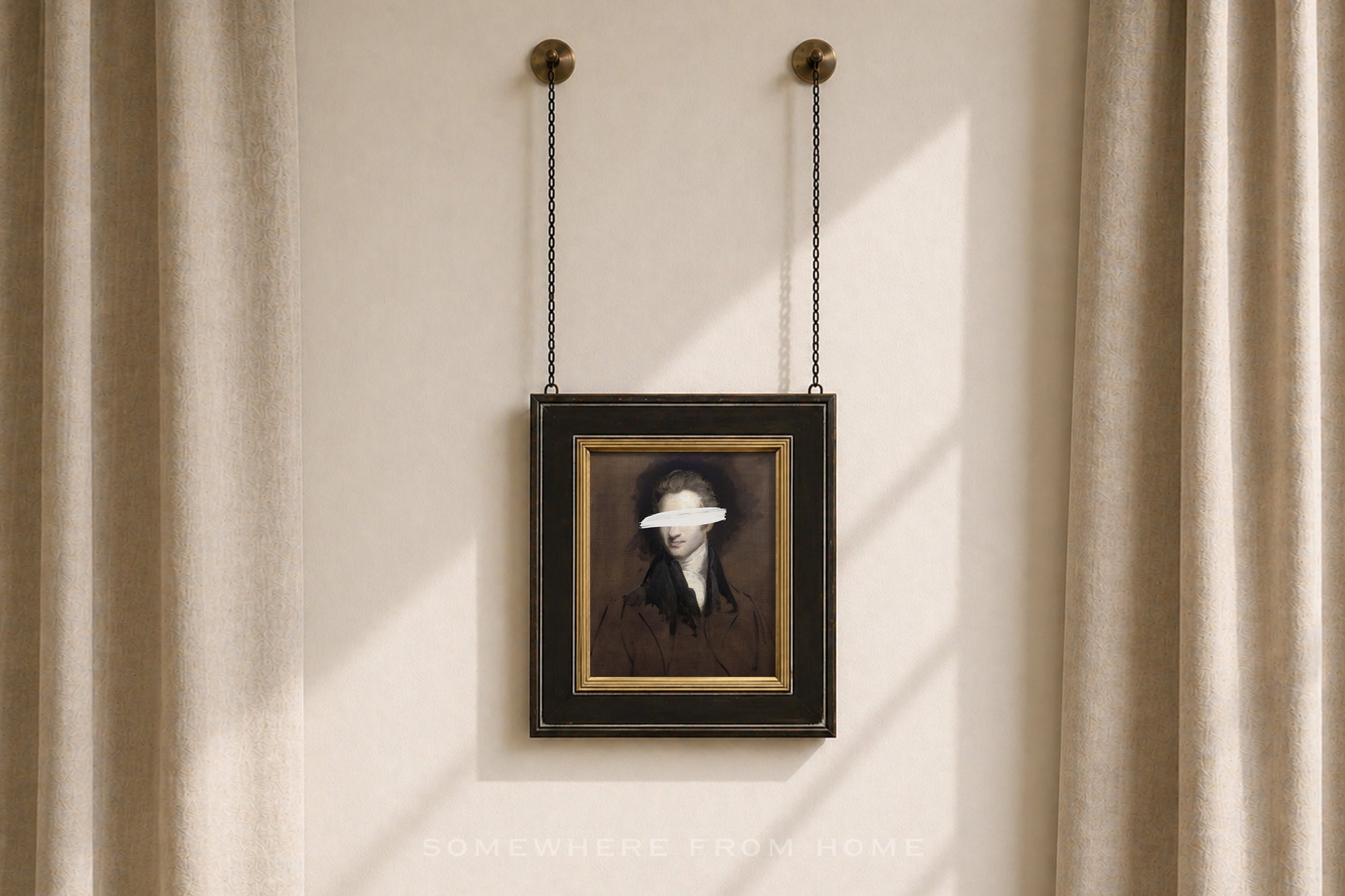 A framed portrait print hanging from two chains on a beige wall between sheer curtains. The artwork shows a dark-haired figure in a dark brown and black outfit with a white blindfold over the eyes, set in a black frame with a gold inner border.