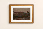 A framed landscape art print featuring a moody, painterly scene with a lone tree and distant hills, enclosed in a textured gold frame with a white mat, mounted on a light beige wall.