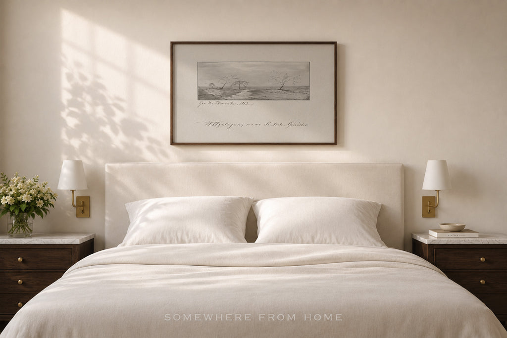 A styled bedroom scene featuring a neatly made bed with white linens and pillows, flanked by matching dark wood nightstands with wall-mounted lamps. Above the bed hangs a framed monochrome landscape print.