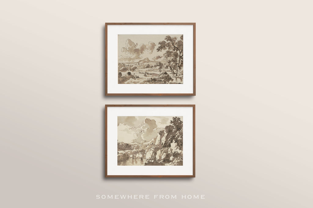Two framed sepia-toned landscape art prints with white mats and thin brown frames, displayed vertically on a light beige wall. The text 'SOMEWHERE FROM HOME' appears below the frames.