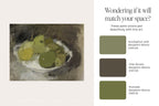 A color and art pairing guide featuring a still life painting of green and yellow pears on the left, and three Benjamin Moore color swatches on the right labeled Eucalyptus Leaf, Char Brown, and Avocado, with the text 'Wondering if it will match your space?'.
