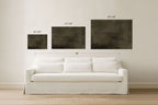 Three framed wall art pieces in different sizes displayed above a white sofa in a bright room, with dimension labels indicating 16"x20", 24"x36", 30"x40", and a total width of 90". Text at the bottom reads 'SOMEWHERE FROM HOME'.